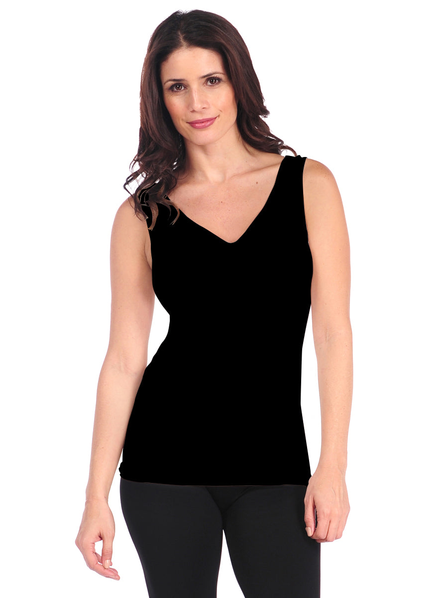 Woman wearing a black tank top on a white background