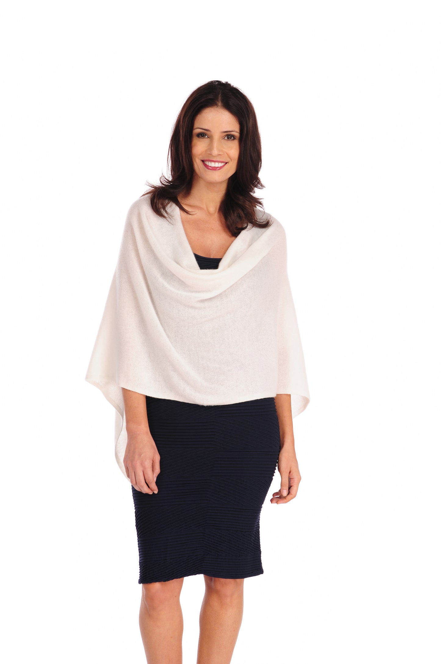 Woman wearing a white shawl over a navy dress on a white background