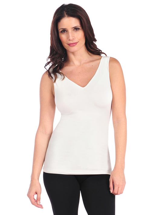 Woman wearing a white tank top on a white background