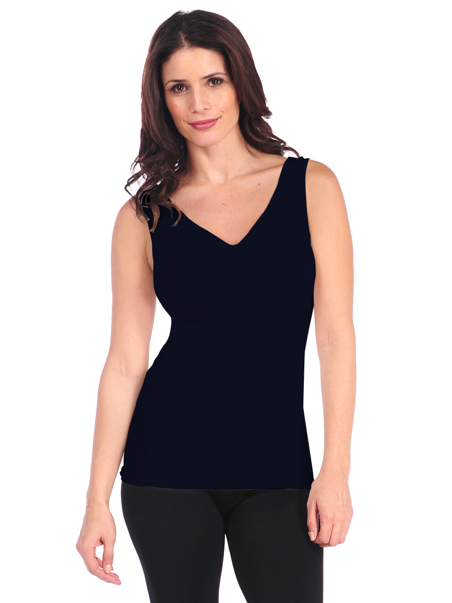 Woman wearing a black tank top on a white background